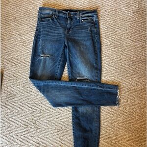 Harper denim jeans with mesh material in the rips